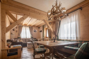 Cortina Deluxe Chalet R&R, Rolle